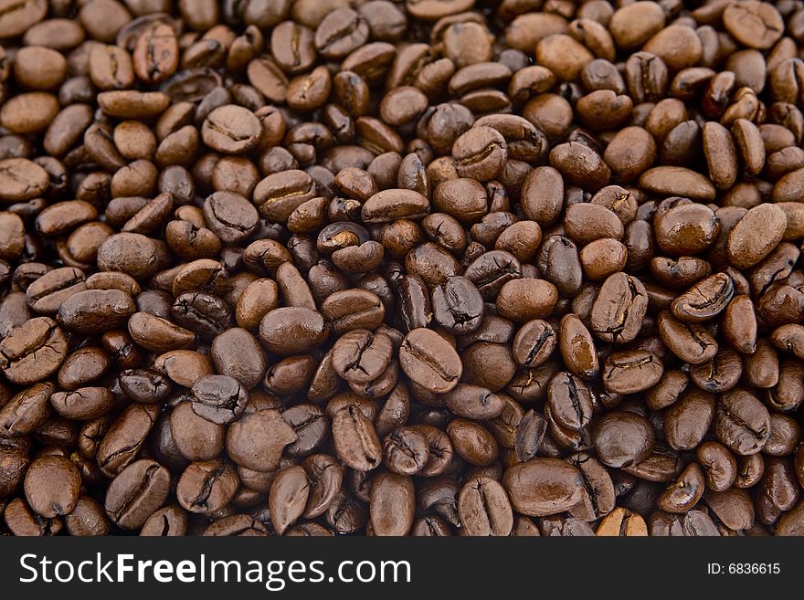 Coffee beans as background, whole beans roasted freshly