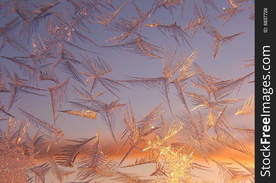 Sunlight thru the window with frosty natural pattern. Sunlight thru the window with frosty natural pattern