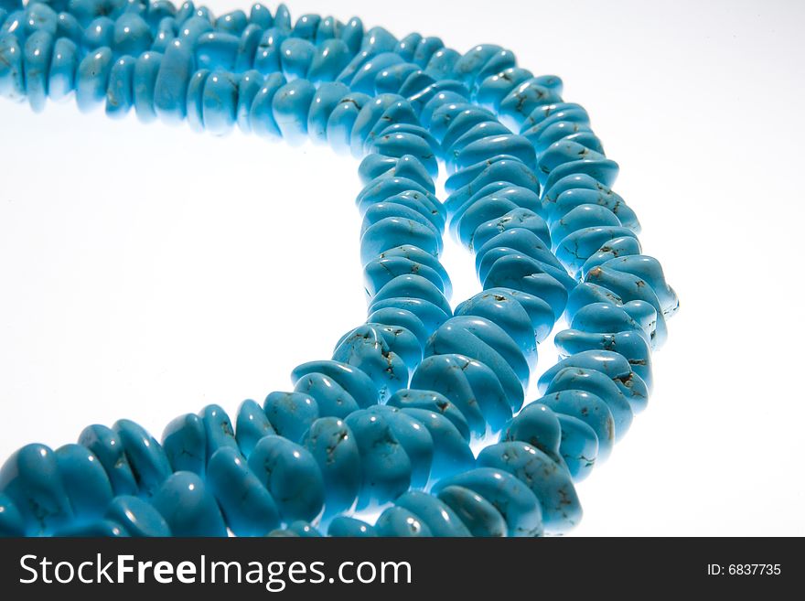 Turquoise beads isolated on white background