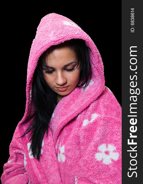 Emo girl in a pink dressing gown, isolated on black