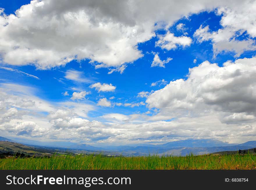 Beautiful green meadow and a nice cloudscape. Beautiful green meadow and a nice cloudscape