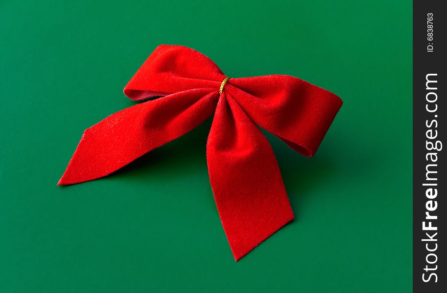 Red ribbon against a green background
