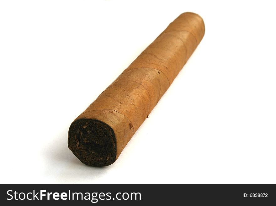 Hand rolled cigar on a white background