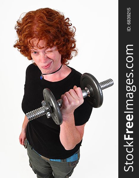 Red head woman lifting weight isolated on white. Red head woman lifting weight isolated on white