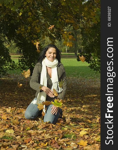 Woman playing with leaves outdoor. Woman playing with leaves outdoor