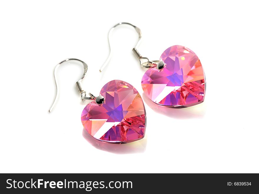 A pair of pink earrings isolated on white background.