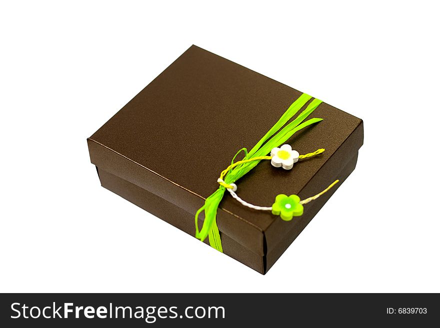 Brown gift box with green decoration isolated on white background