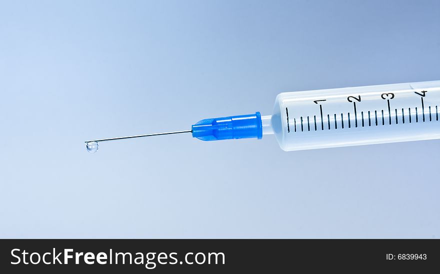 Syringe With Blue Drop
