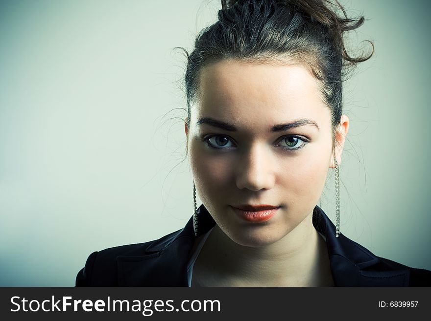 Portrait of young cute girl with unworried face. Portrait of young cute girl with unworried face.