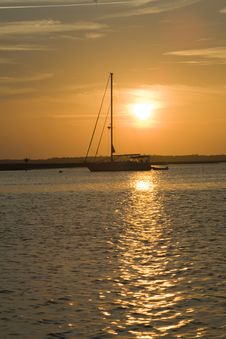 Sailboat At Sunset In Coastal Harbor Stock Photography Sailboat At Sunset In Coastal Harbor Stock Photography