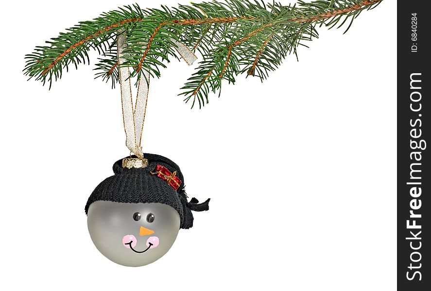 Christmas ornament hanging from an evergreen branch isolated on white