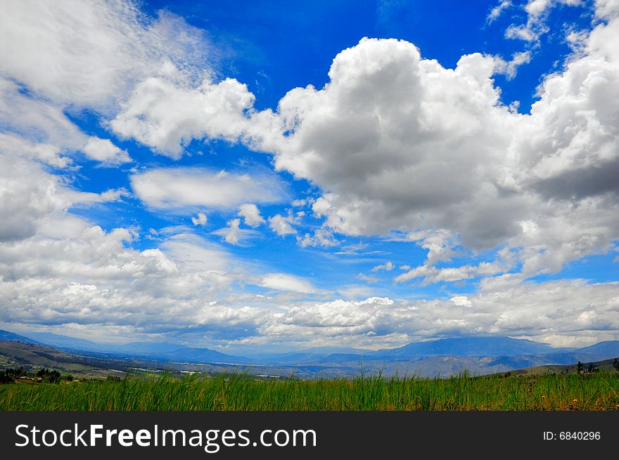 Beautiful green meadow and a nice cloudscape. Beautiful green meadow and a nice cloudscape