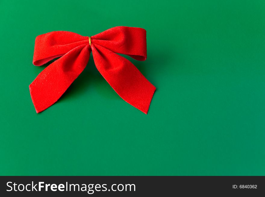 Red ribbon against a green background