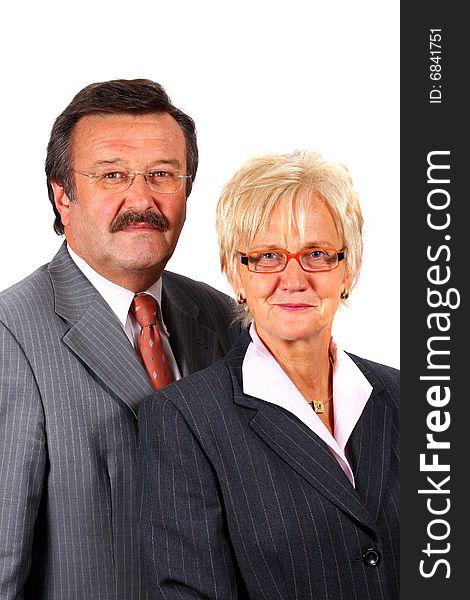 A senior business couple in suits in their 50s and 60s. Isolated over white. A senior business couple in suits in their 50s and 60s. Isolated over white.