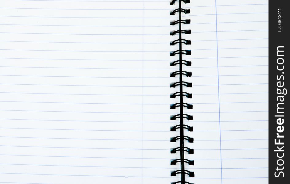 Open notebook with black spiral and blue lines