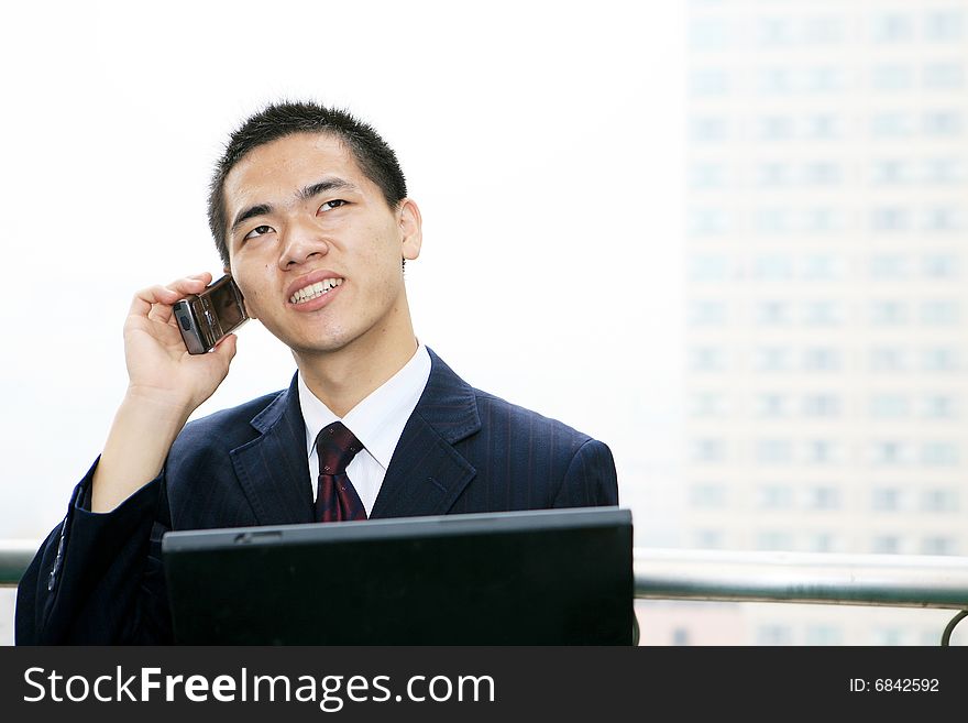 Businessman Holding Laptop Computer