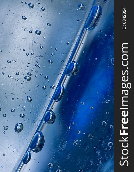 A closeup shot of droplets inside an empty mineral water container. A closeup shot of droplets inside an empty mineral water container.