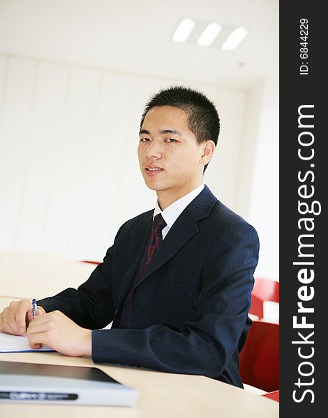 Young asian business man working in office