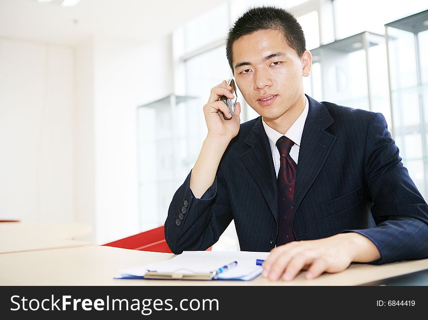 A young asian working in office
