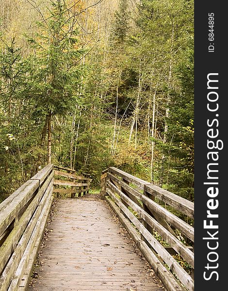 Wooden bridges through the mountain river in the Alpes. Wooden bridges through the mountain river in the Alpes