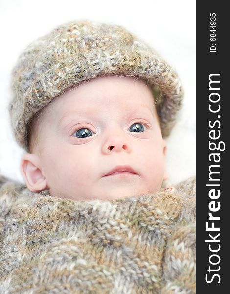 Newborn baby in winter clothes