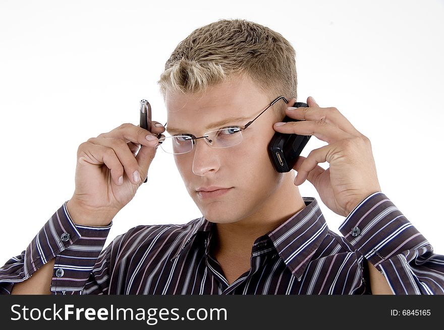 Serious businessman communicating on cell phone isolated with white background