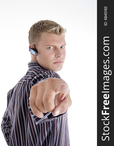 Professional caucasian guy pointing against white background