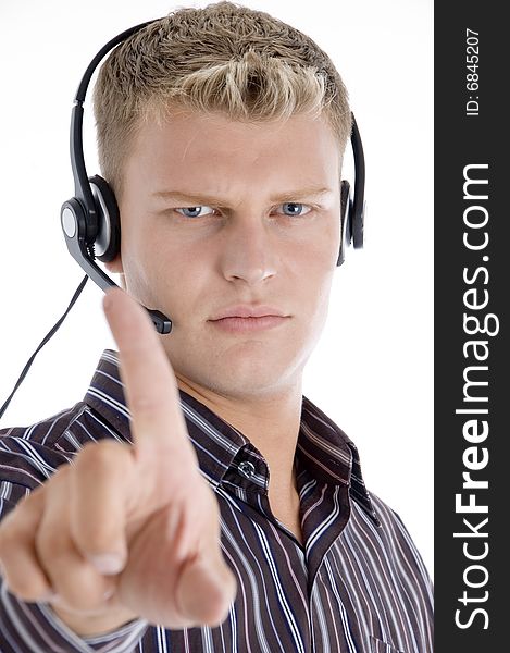 Male with headset showing his index finger against white background