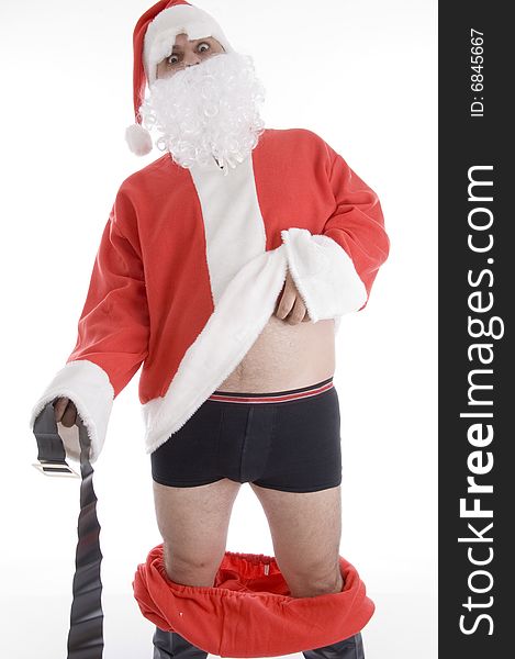 Santa clause holding his coat and belt on an isolated white background