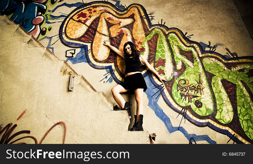 Rebel young girl posing in her hiding place