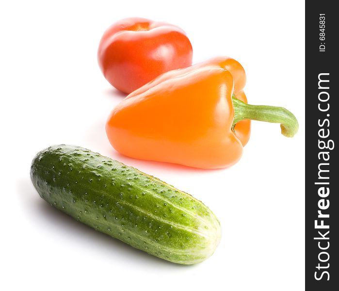 Cucumber, pepper and tomato isolated on white