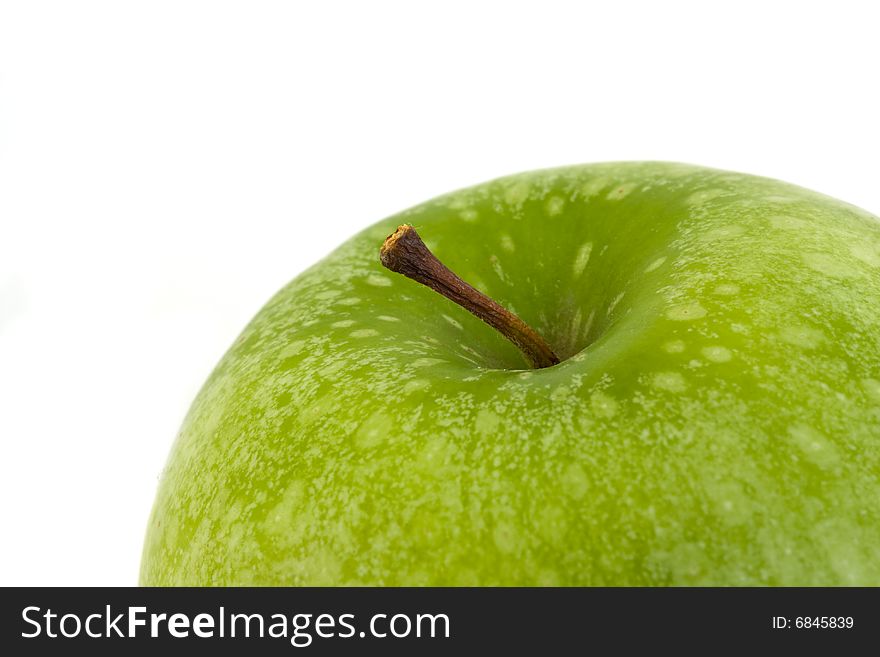 Detail of a granny smith apple isolated on white background