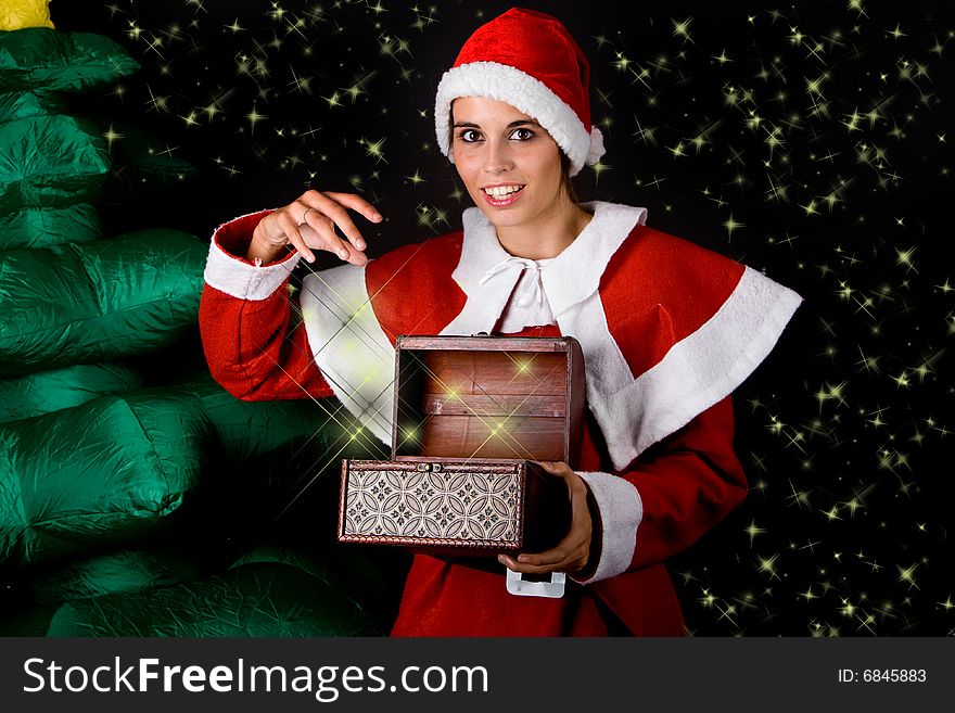 Beautiful sexy girl wearing santa claus clothes near christmas tree
