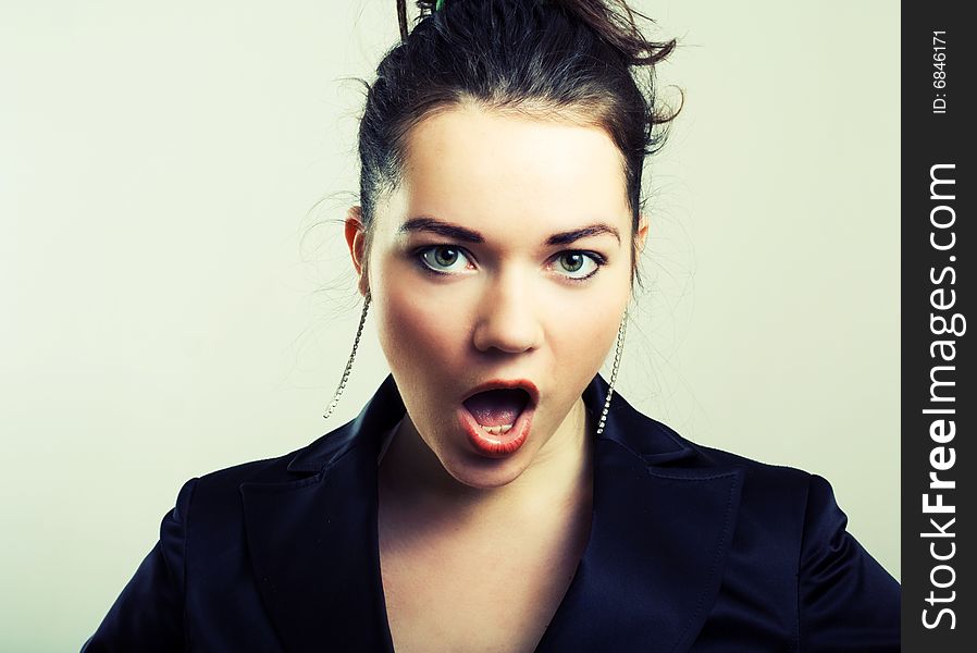 Portrait of young screaming girl.