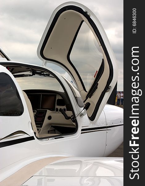 A partial view of cockpit of a executive jet, viwed by a open door. A partial view of cockpit of a executive jet, viwed by a open door