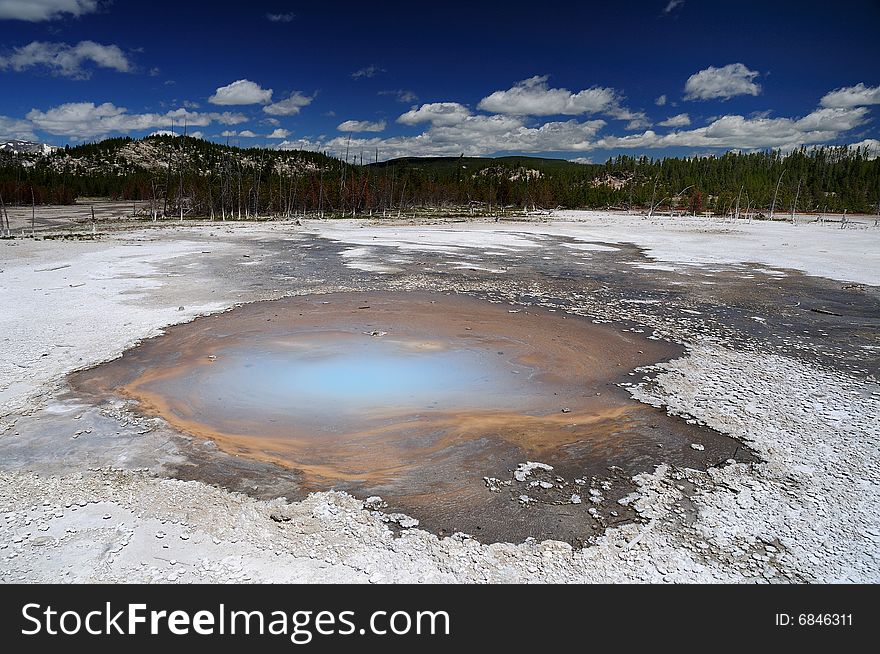 Volcanic hot pool in yellowstone national park on a beautifull spring day. Volcanic hot pool in yellowstone national park on a beautifull spring day.