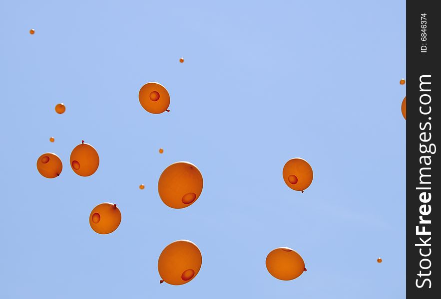 Orange balloons in the blue sky. Orange balloons in the blue sky.