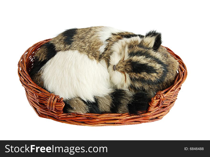 Artificial cat, sleeping in a basket. Artificial cat, sleeping in a basket