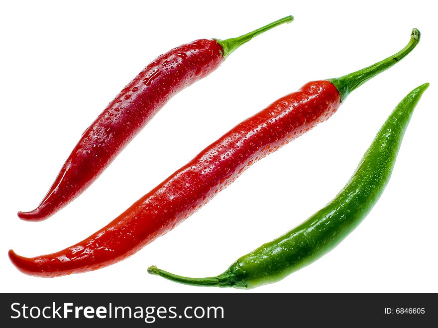 A shot of three isolated chilis. A shot of three isolated chilis