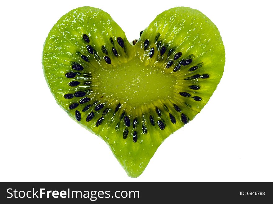 A shot of a kiwi slice in heart shape. A shot of a kiwi slice in heart shape