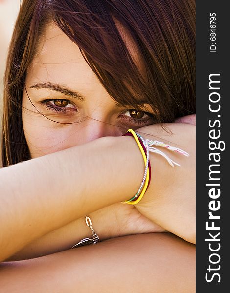 Young staring woman with her hair moved by the wind