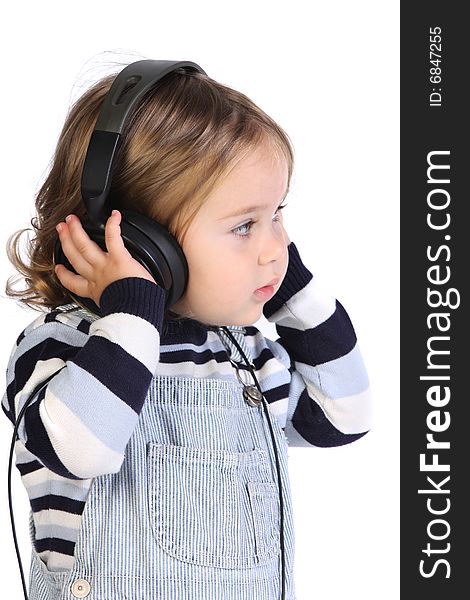 Beauty a little girl listening music on white background