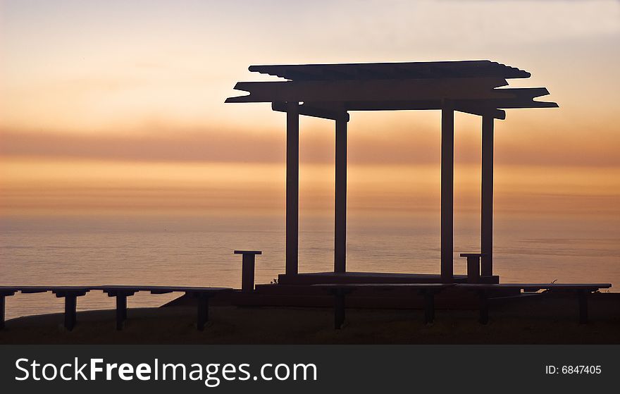 This is a picture of a brilliant sunrise on California's Big Sur coast with a gazebo in the foreground. This is a picture of a brilliant sunrise on California's Big Sur coast with a gazebo in the foreground.