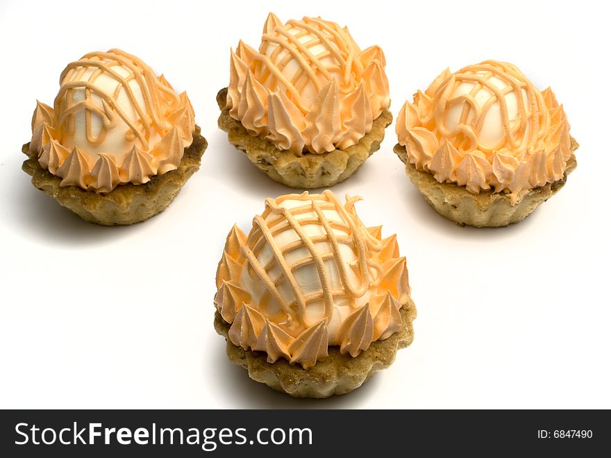 Four cake with a zephyr isolated on a white background