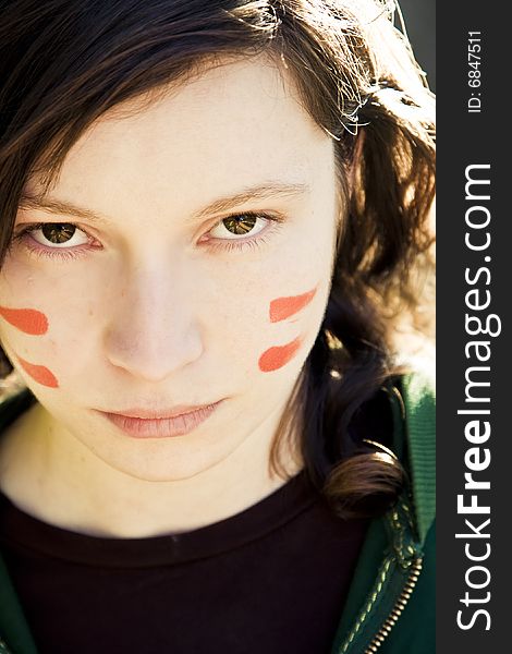 Young woman showing her country colors in her face. Young woman showing her country colors in her face.