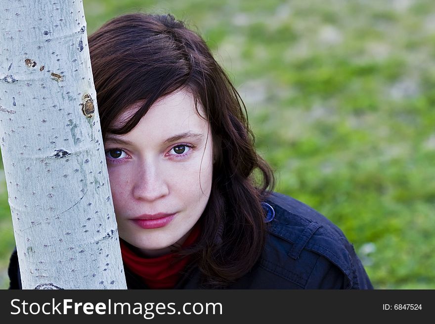 Young beautiful woman portrait in fall season.