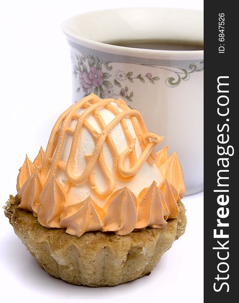 Cup of tea and cakes on a plate on a white background it is isolated