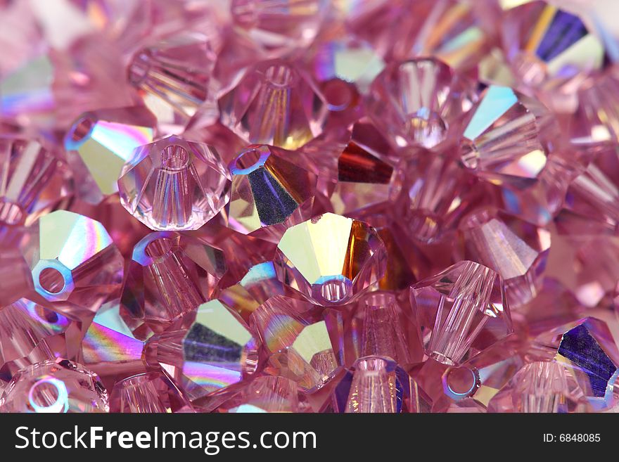 Close up of a pile of light purple beads.