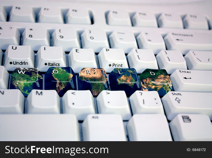 The keyboard with the text the World and an earth card on keys. The keyboard with the text the World and an earth card on keys