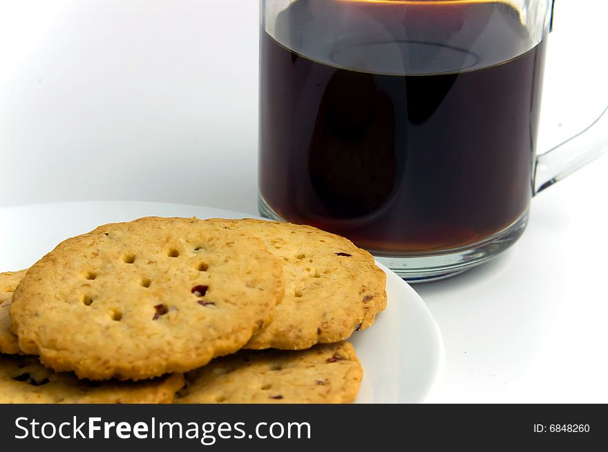 A plate of cookies and a cup of coffee. A plate of cookies and a cup of coffee